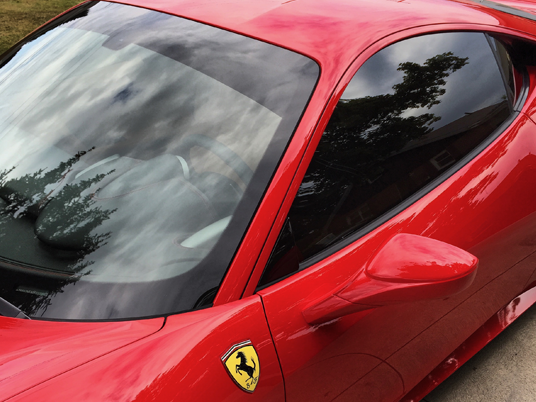 Auto Window Tint on a red car.